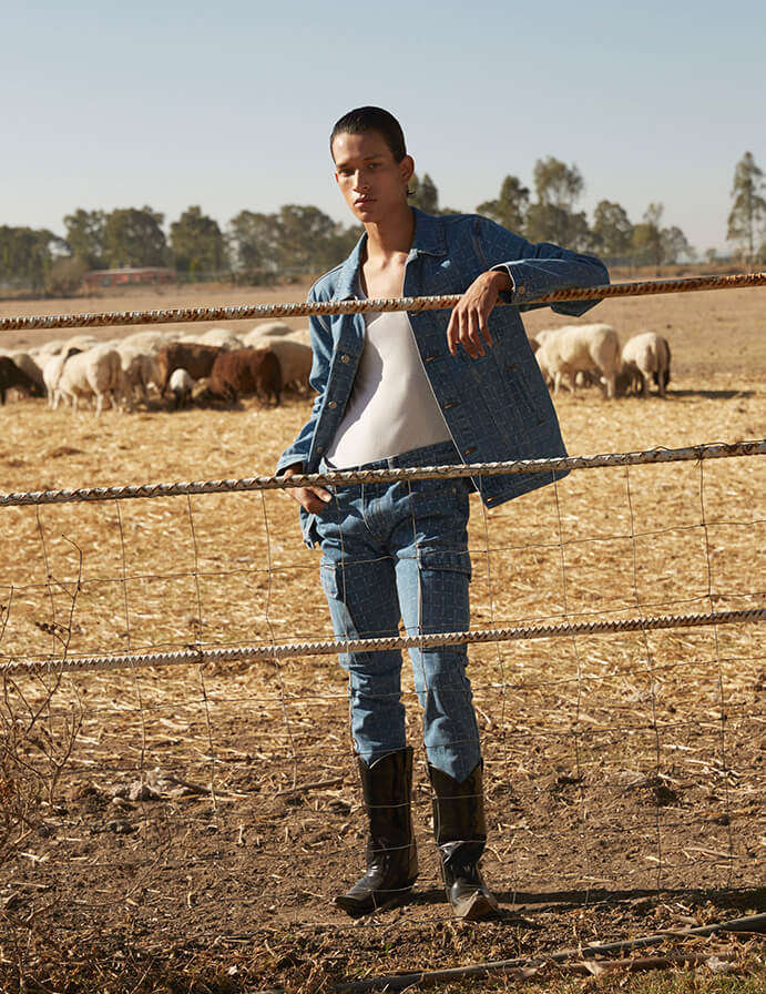 Male model wearing denim on a ranch