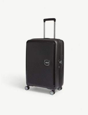AMERICAN TOURISTER: Soundbox expandable four-wheel suitcase 67cm