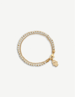 ASTLEY CLARKE: Hamsa hand charm 18ct gold-plated sterling silver, sapphire pavé and rainbow moonstone bracelet