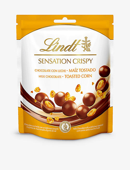 LINDT: Milk chocolate coated toasted corn 140g
