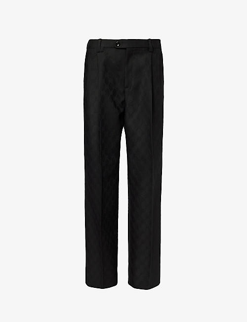 GUCCI: Monogram-pattern pleated mid-rise wool trousers