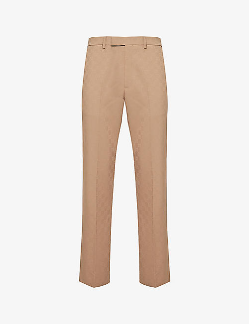 GUCCI: Monogram-embellished tapered-leg woven trousers