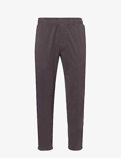 ARNE: Garment-dyed tapered-leg stretch-cotton trousers
