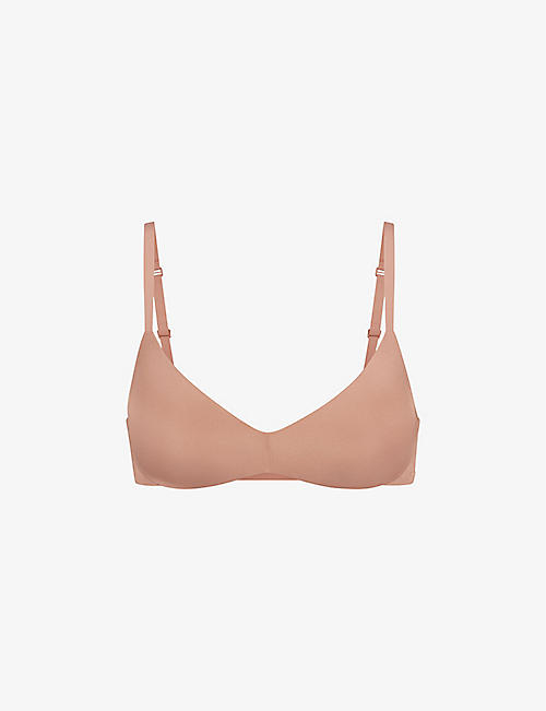 SKIMS: Wireless Form logo-embossed plunge stretch-cotton bra