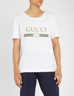GUCCI - Fake logo-print cotton-jersey T-shirt | Selfridges.com