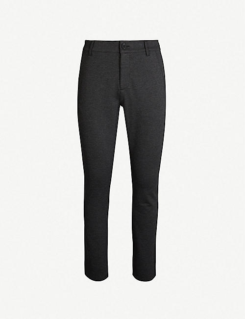 PAIGE: Stafford slim-fit tapered-leg stretch-jersey trousers
