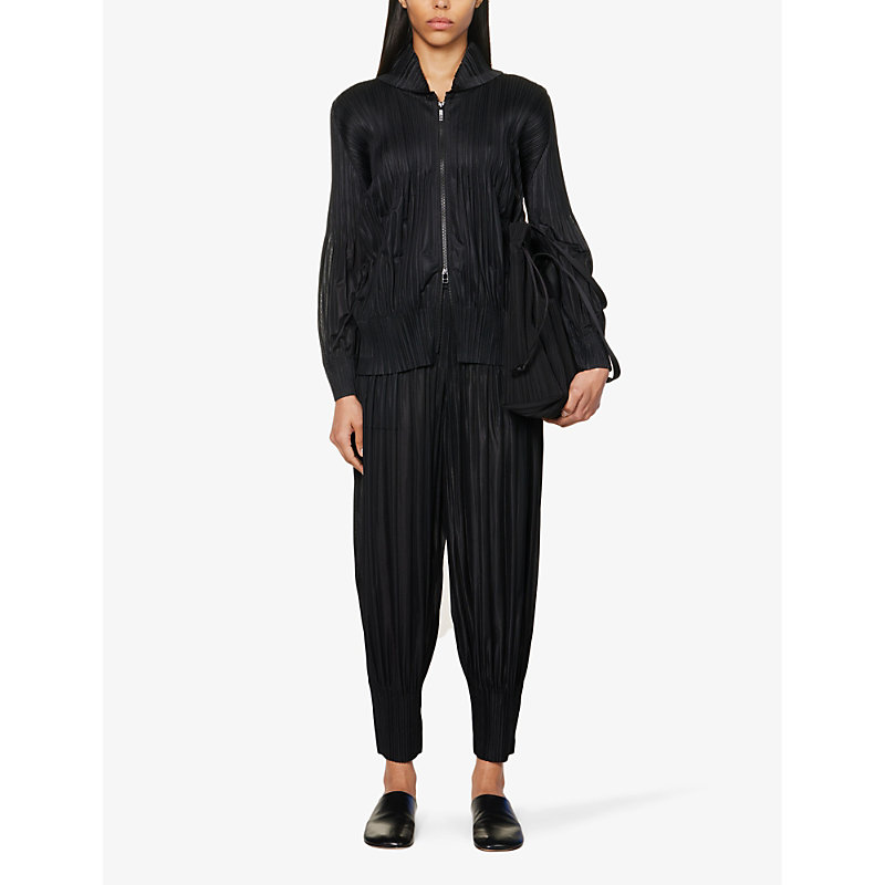 Shop Issey Miyake Pleated Cropped High-rise Knitted Jersey Trousers In Black