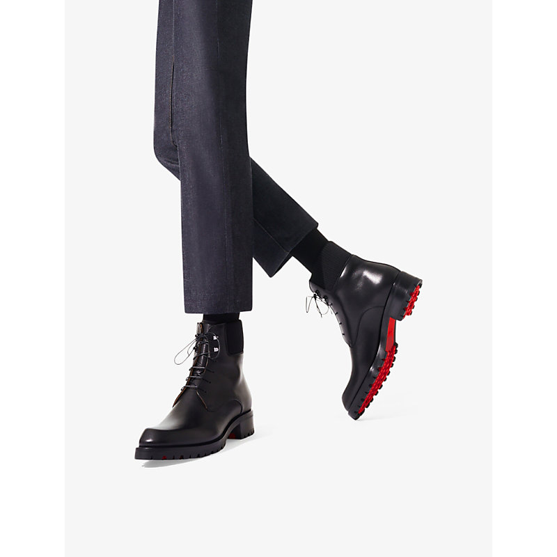 Shop Christian Louboutin Trapman 20 Leather Ankle Boots In Black