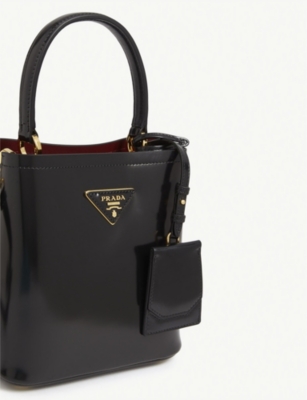 Delve in our edit of Prada women's bags 