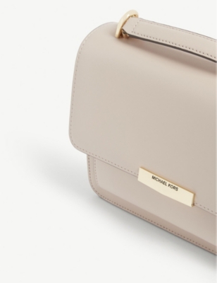cream colored michael kors purse