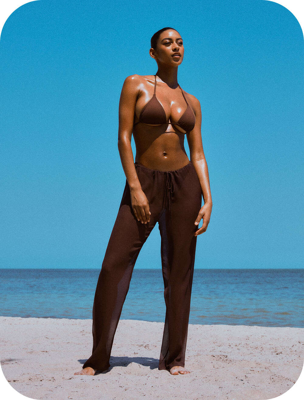 Model wears cocoa SKIMS Swim