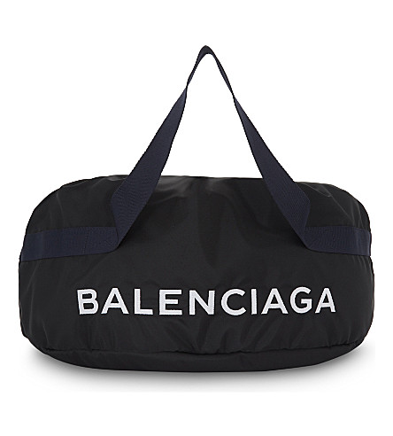 BALENCIAGA - Nylon wheel bag | Selfridges.com
