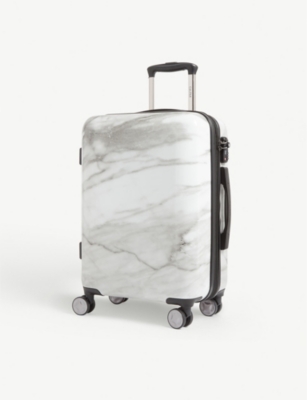 white calpak luggage