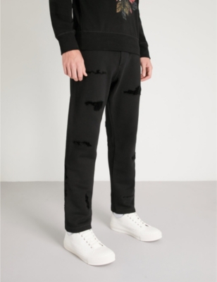 ripped jogging bottoms