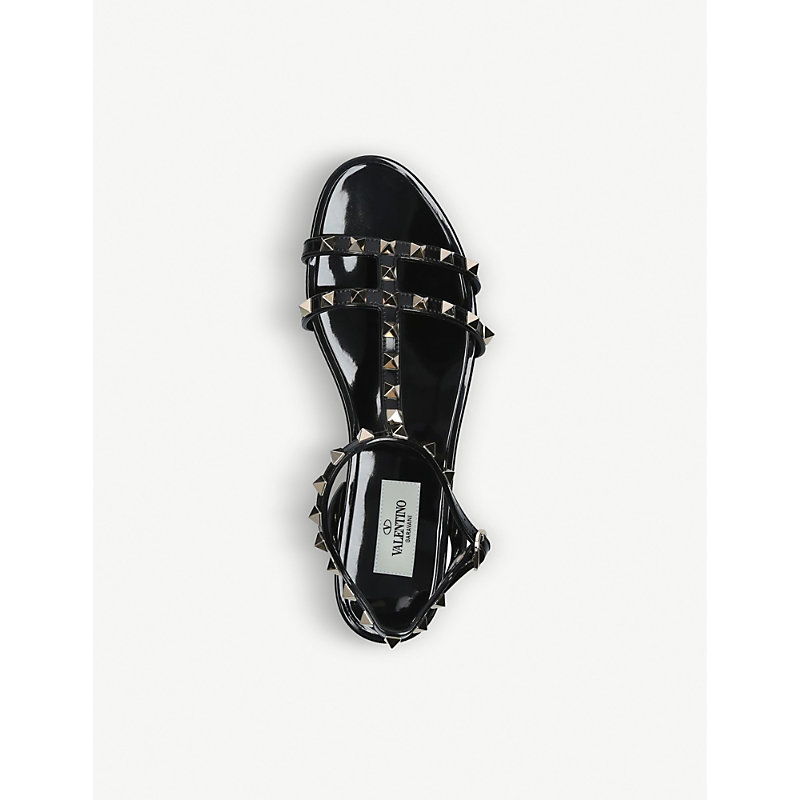 Shop Valentino Garavani Womens Black Rockstud Pvc Gladiator Sandals