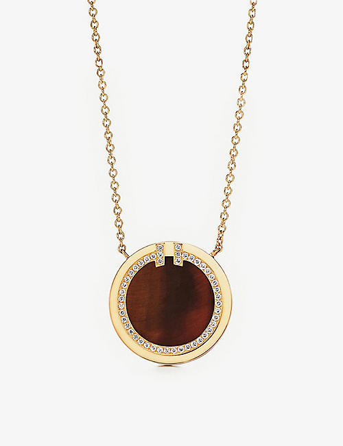 TIFFANY & CO: Tiffany T Circle 18ct gold, tiger’s eye and 0.05ct diamond pendant necklace