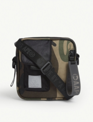 AAPE - Camouflage nylon crossbody bag | Selfridges.com