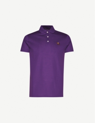 green polo shirt with orange horse