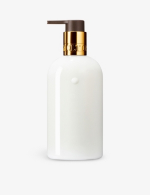 Shop Molton Brown Mesmerising Oudh Accord And Gold Hand Lotion