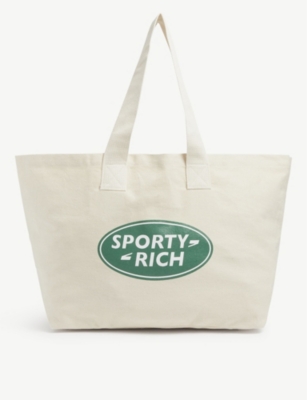 SPORTY & RICH - Logo-printed cotton canvas tote bag | Selfridges.com