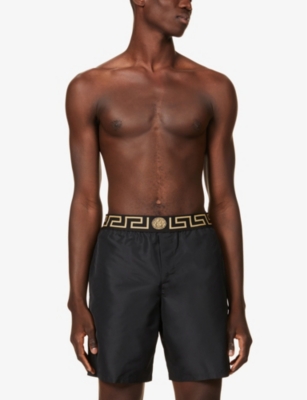 Greca border swim shorts in blue - Versace