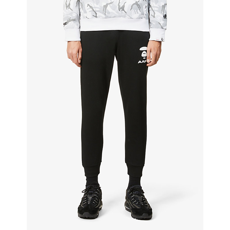 Aape Logo-print Relaxed-fit Cotton-blend Jogging Bottoms In Black