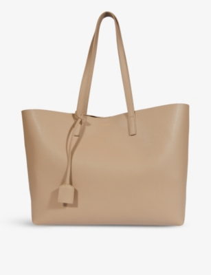 SAINT LAURENT - Logo-print leather tote bag | Selfridges.com