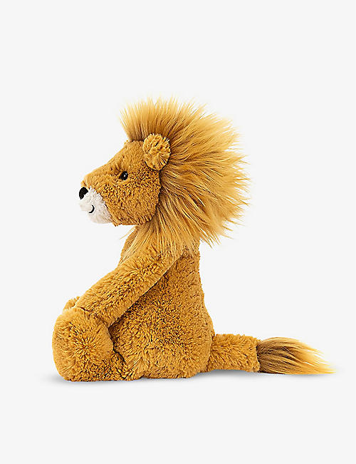 Cute angel plays with hot toys and bear