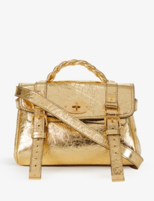 Metallic satchel outlet