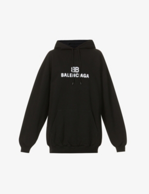 BALENCIAGA Distorted logo print cotton jersey hoody Selfridges