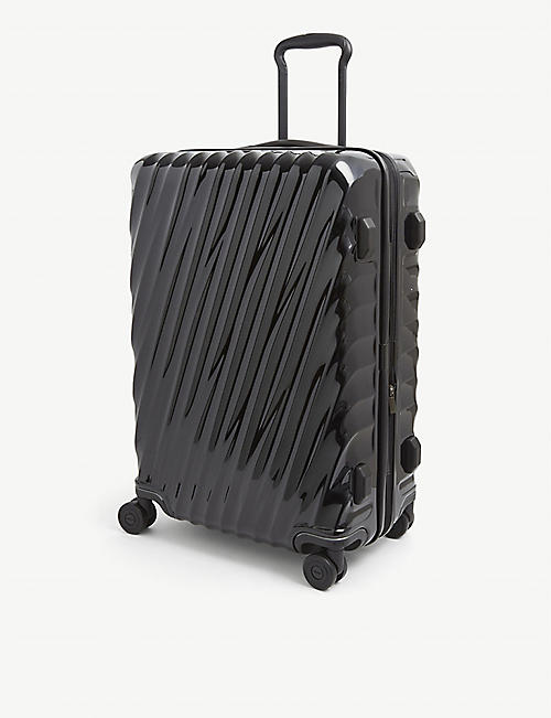 TUMI: International Expandable 19 Degree large polycarbonate suitcase