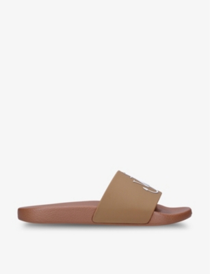 JW ANDERSON Logo embossed rubber slides Selfridges