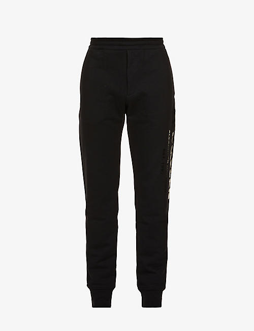 ALEXANDER MCQUEEN: Graffiti-print relaxed-fit tapered cotton-jersey jogging bottoms