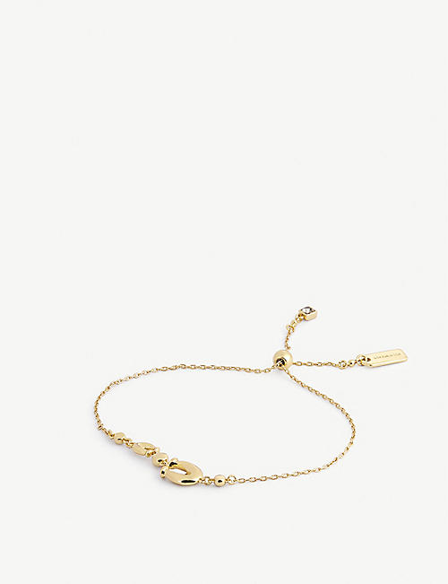 COACH: Charm-embellished gold-plated brass and Swarovski crystal slider bracelet