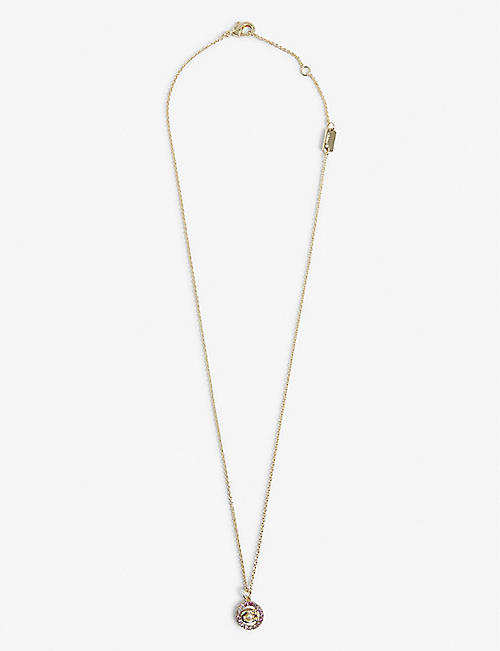 COACH: Signature crystal and yellow gold-toned brass pendant necklace