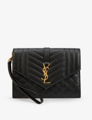 SAINT LAURENT - Envelope quilted leather clutch bag | Selfridges.com