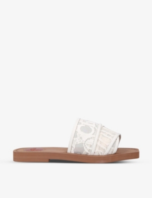 CHLOE Woody logo print lace sandals Selfridges