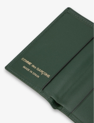 COMME DES GARCONS: Classic logo-embossed leather card holder