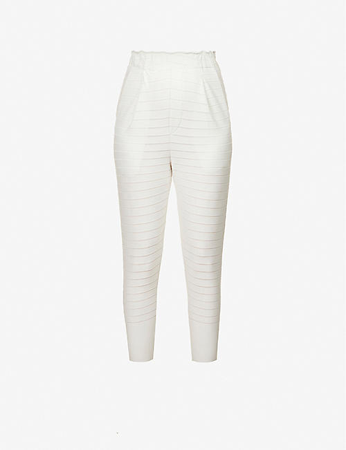 ISSEY MIYAKE: Striped tapered mid-rise woven trousers