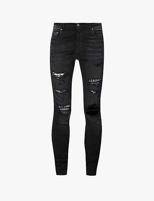 AMIRI: Hibiscus patch slim-fit stretch-denim skinny jeans