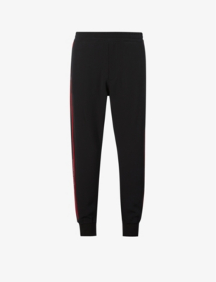 Alexander Mcqueen Logo-tape Straight Stretch-woven Jogging Bottoms In Black