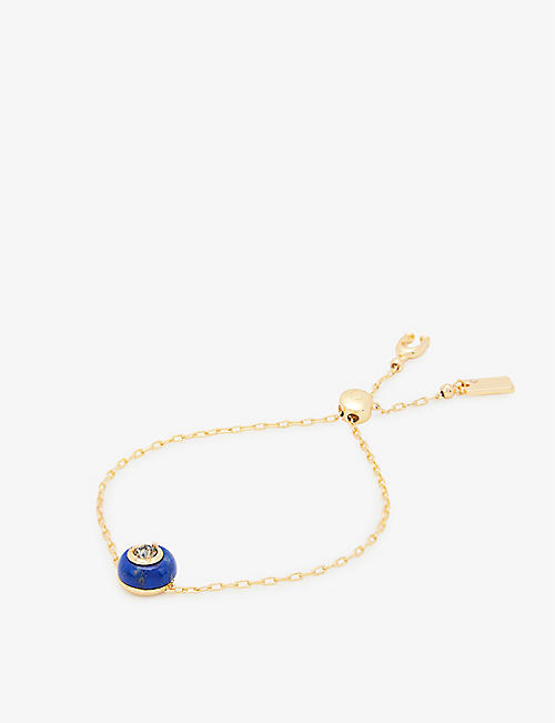 COACH: Brand-engraved gold-toned brass and brilliant-cut crystal bracelet