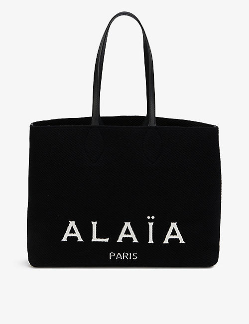 ALAIA: Logo-print woven tote bag