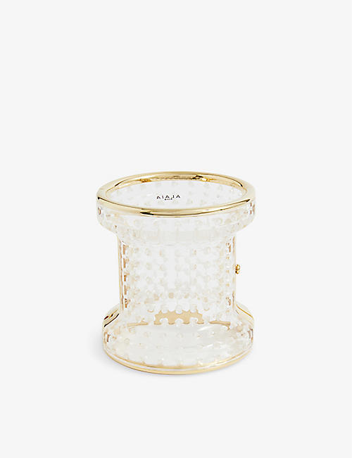 ALAIA: Perforated plexi and brass cuff bracelet