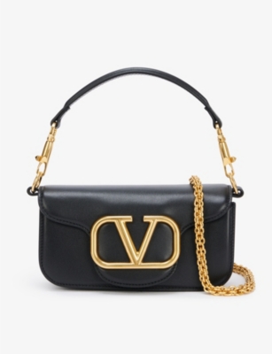 Shop Valentino Garavani Women's Black Vlogo Small Baguette Leather Shoulder Bag