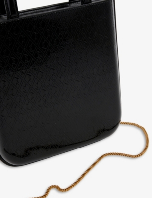 Shop Saint Laurent All Over Logo-embossed Leather Tote Bag In Black