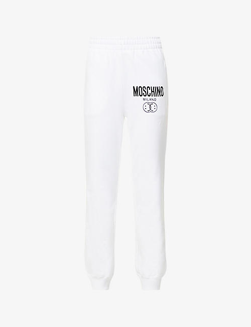 MOSCHINO: Smiley brand-print organic-cotton jogging bottoms