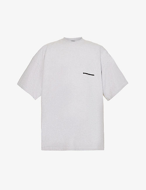 BALENCIAGA: Strikethrough logo-print oversized-fit cotton-jersey T-shirt