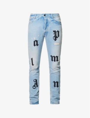 PALM ANGELS - Logo-appliqué regular-fit tapered-leg jeans | Selfridges.com