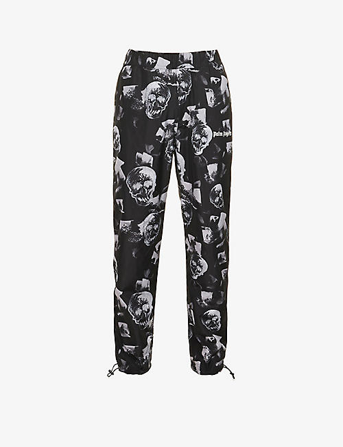 PALM ANGELS: Skulls graphic-print relaxed-fit shell jogging bottoms